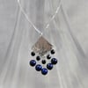 Fringed hammered silver and blue lapis pendant