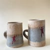 Set of 2 climber ceramic cups.