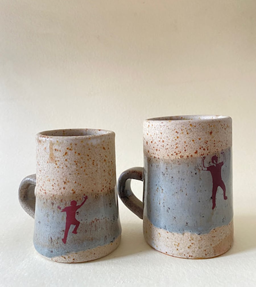 Set of 2 climber ceramic cups.
