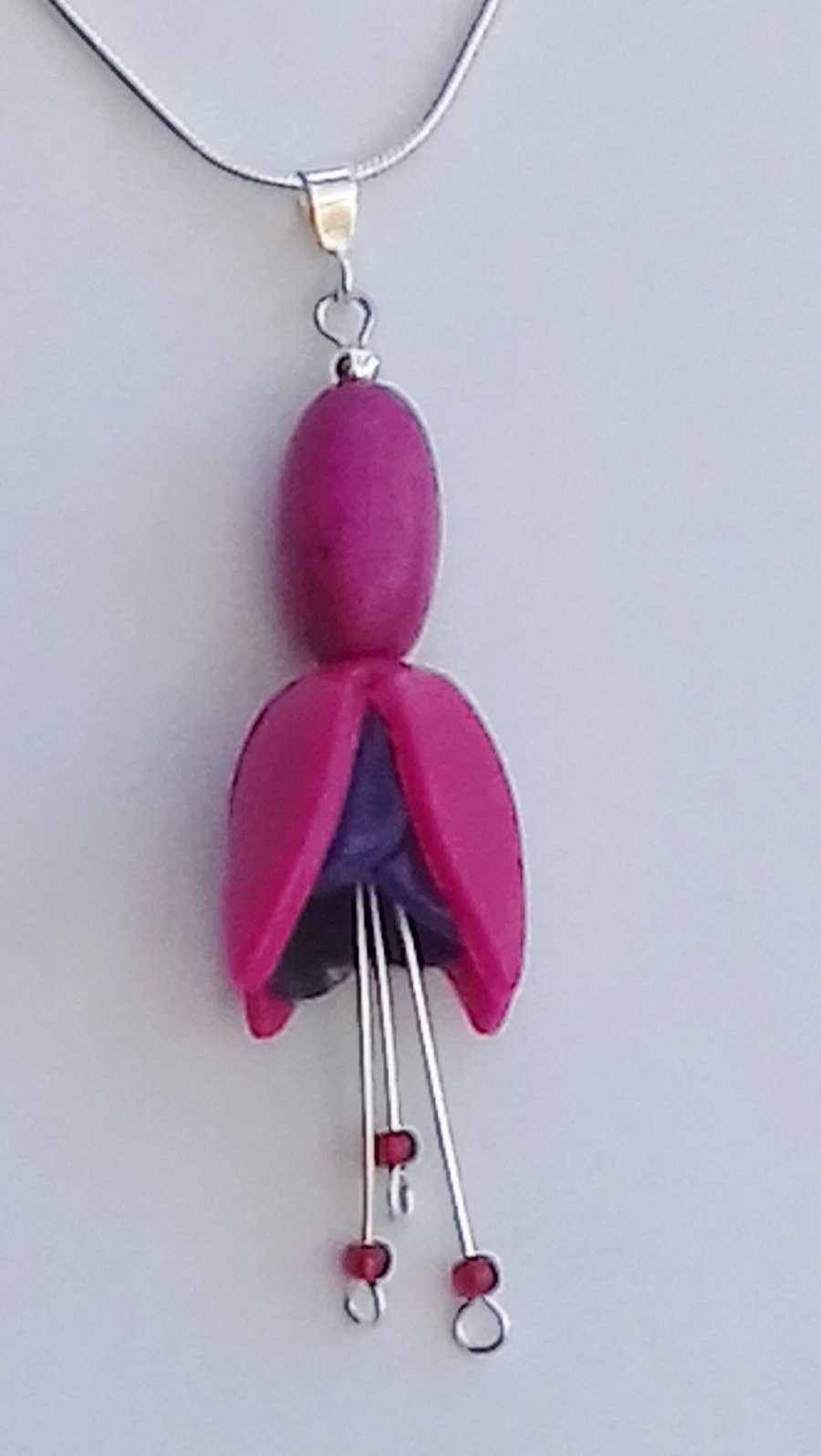 Fuchsia flower pendant, on silver plated chain