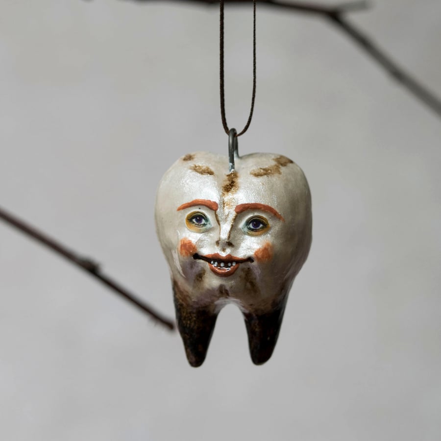 Rancid Colin tooth, a miniature Halloween ceramic hanging decoration