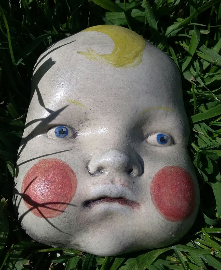 Ceramic doll faces.