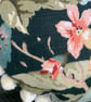 Round feature cushion in vintage leafy linen with pompoms - Image 3