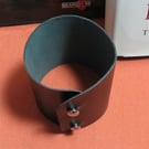 57 mm width black leather wristband.