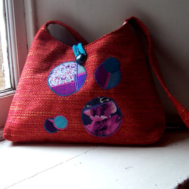 Fabric shoulder bag with feature appliques