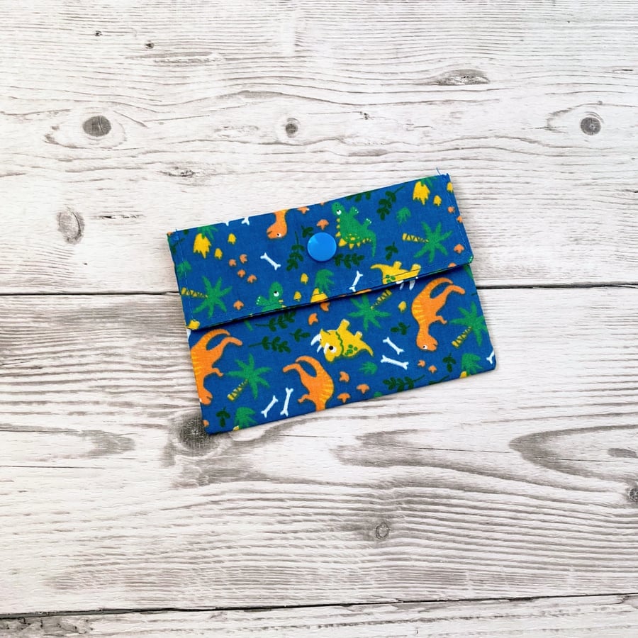 Dinosaurs on blue fabric card holder pouch. Loyalty, credit, debit cards purse. 