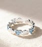 Brushed Silver Open Ring with Aquamarine Heart Accent