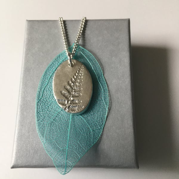 SOLD——-Oval pendant with Fern leaf imprint