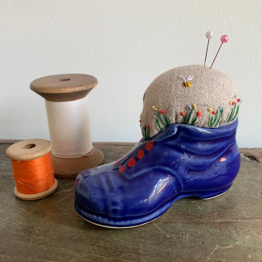  Embroidered pin cushion in a china boot