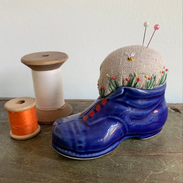  Embroidered pin cushion in a china boot