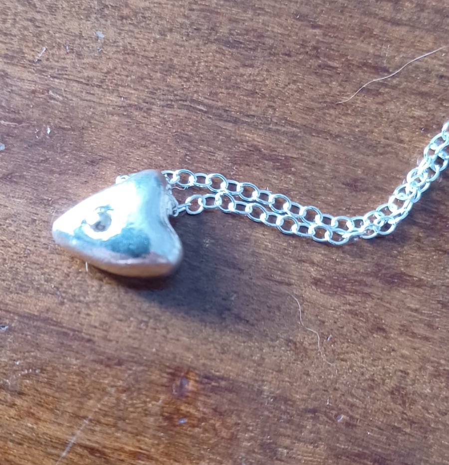 Silver and gold heart pendant