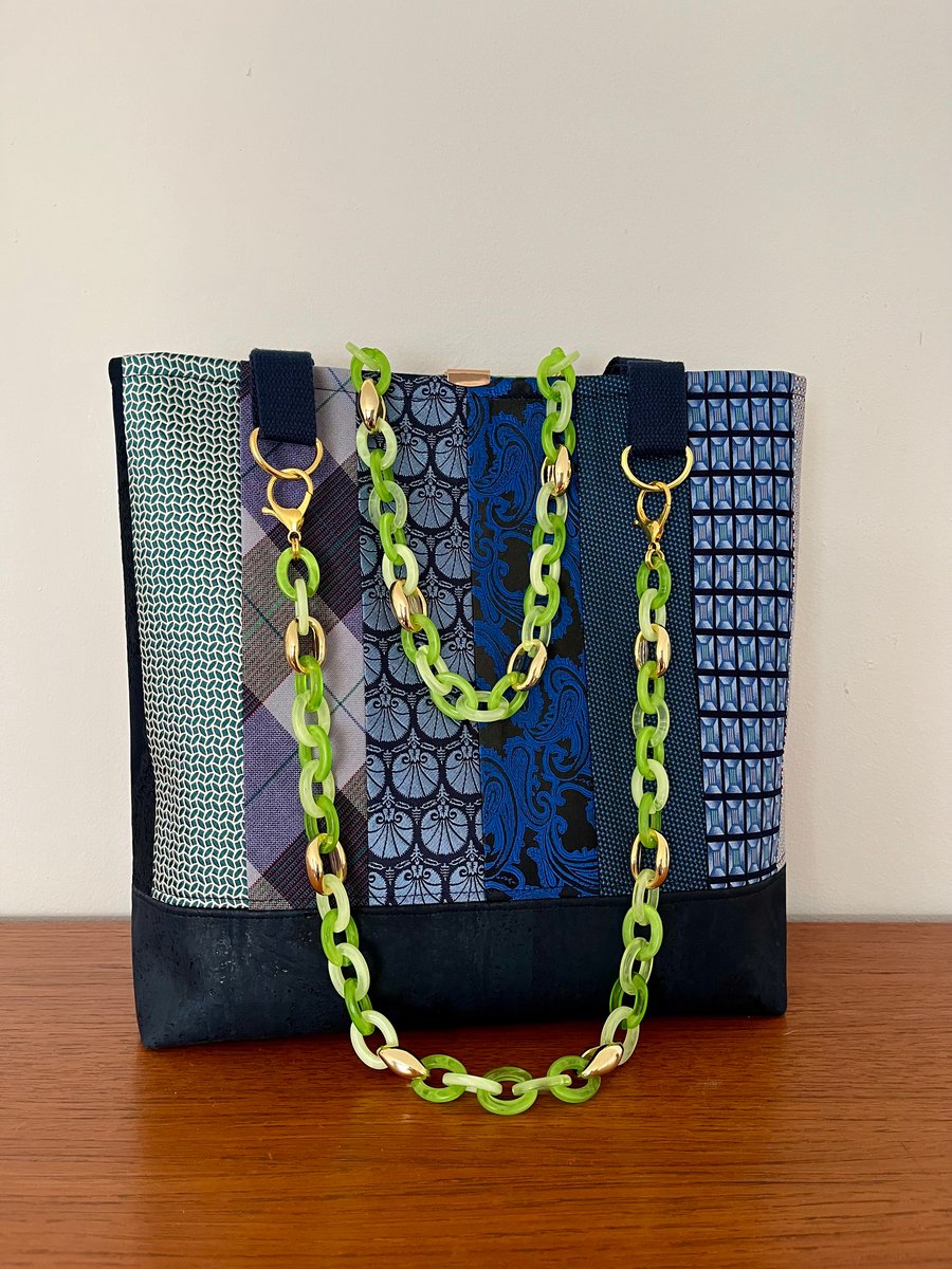 Unique, large shoulder bag in navy blue tones