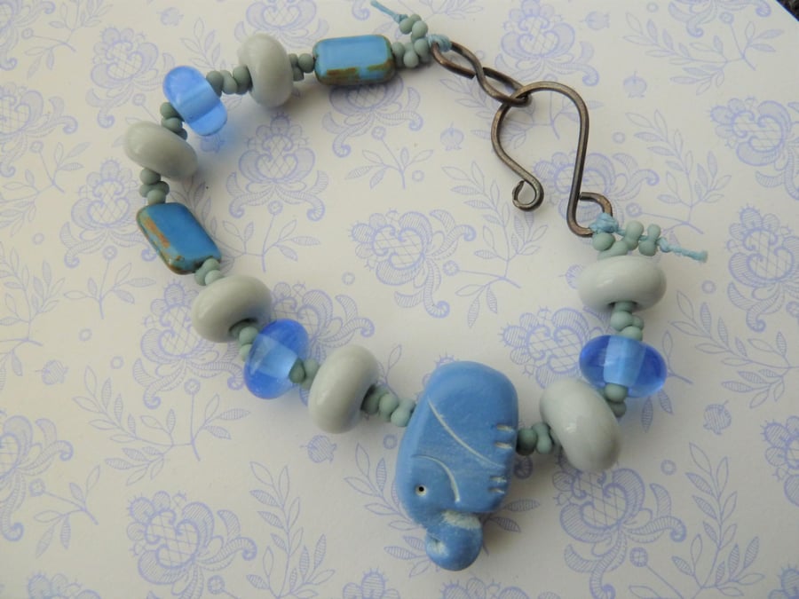 blue elephant lampwork and copper bracelet