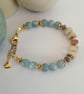 Aquamarine beaded bracelet, white beryl, strawberry quartz & Tanzanite - Image 5