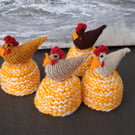 A Set Of Four Egg Cosies With A chicken On Top Of Each (R301)