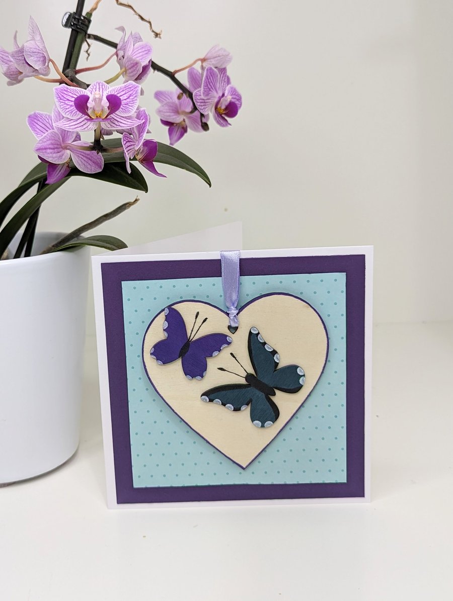 Pretty handmade card with butterfly detachable wooden heart keepsake decoration 