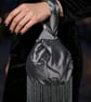 Silvery Grey satin Japanese knot bag with a floral 3D pattern and long tassels