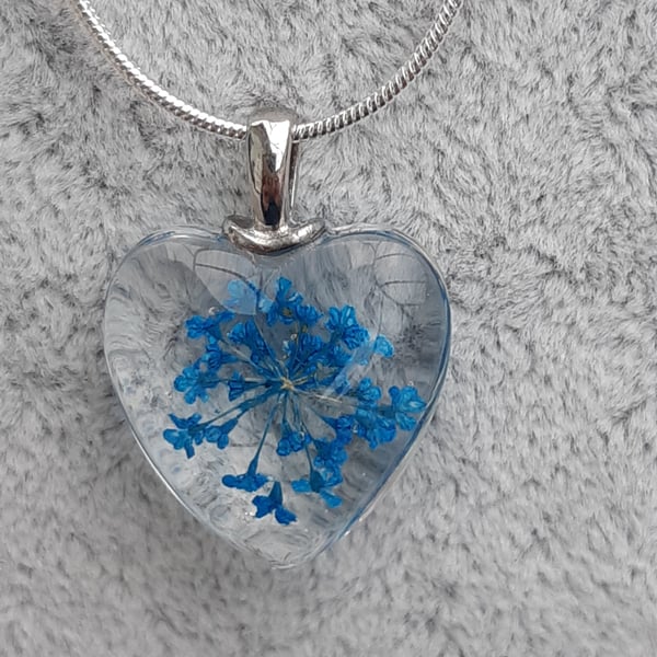 Blue flower heart shaped pendant