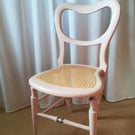 Antique chair in pale pink chalk paint.