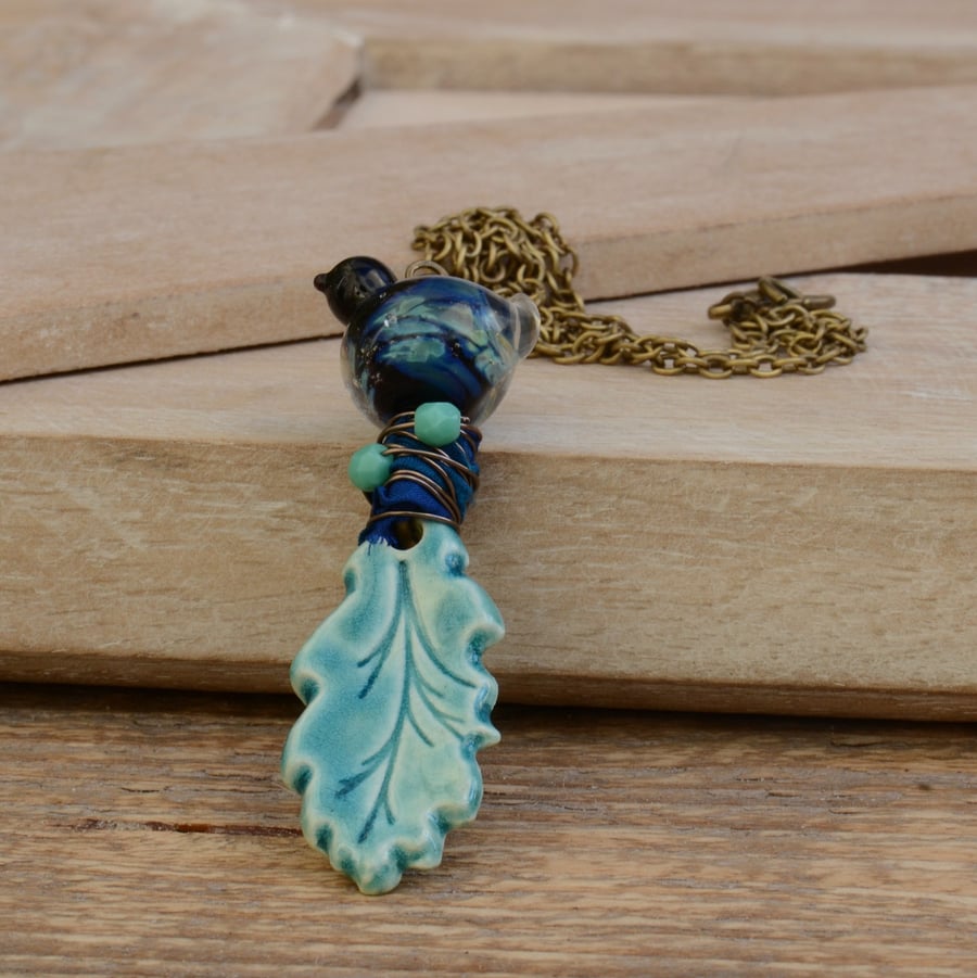 Ceramic Oak Leaf Pendant Necklace with Lampwork Glass Bird & Sari Silk Ribbon