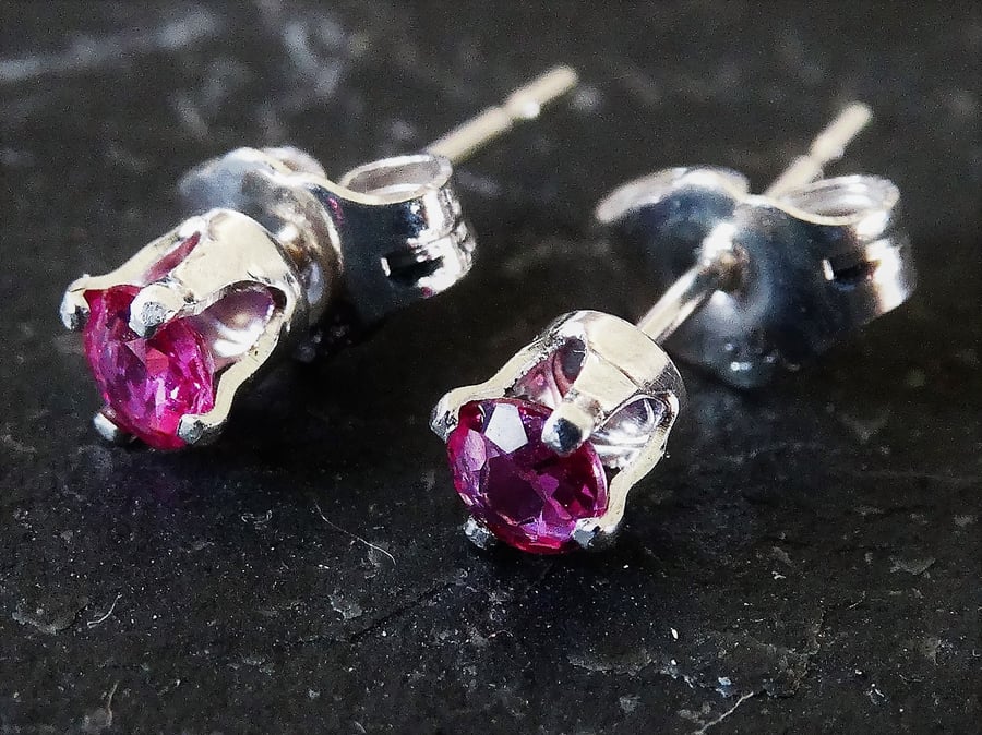 Ruby studs set in sterling silver