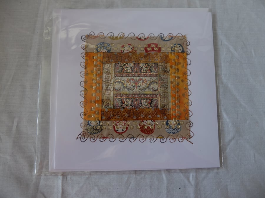 Log cabin quilt block card, embroidered around fragment of ribbon