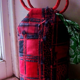 Patchwork fabric bucket bag in red and black mixed textiles