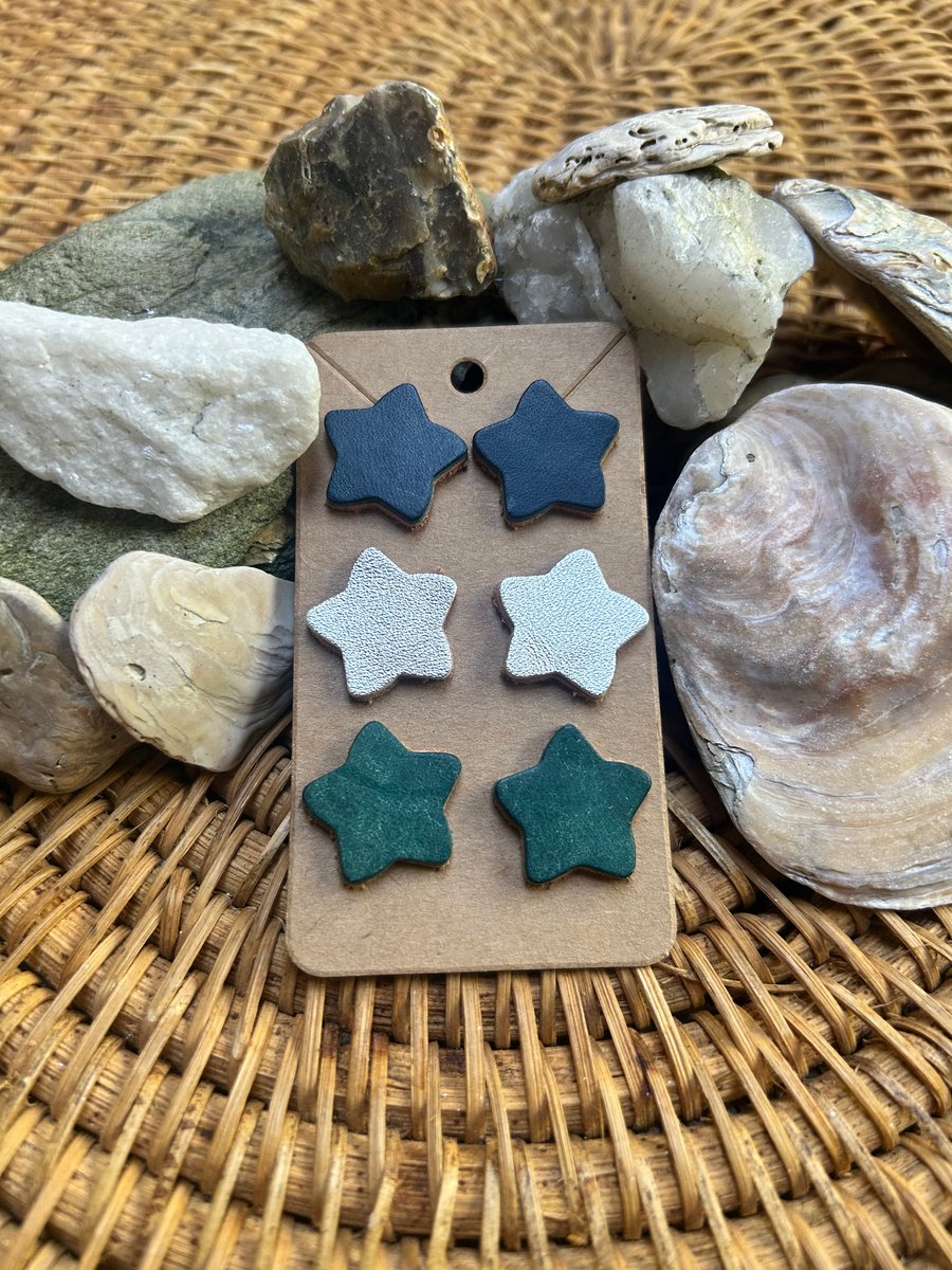 Three pairs of leather star stud earrings 