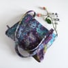 Shoulder bag with a chunky zip, made in a painterly, abstract, designer fabric. 