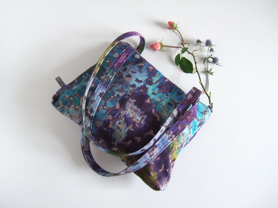 Shoulder bag with a chunky zip, made in a painterly, abstract, designer fabric. 