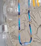 Long Summer Swirl Beaded Necklace in shades of blue with handmade paper beads - Image 6