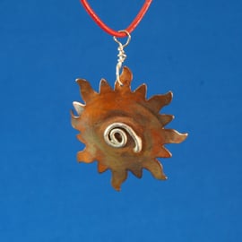 Spiral Sun Brass and Silver pendant
