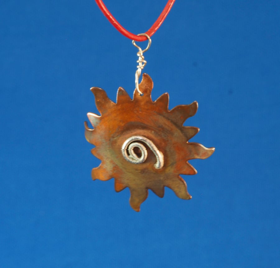 Spiral Sun Brass and Silver pendant