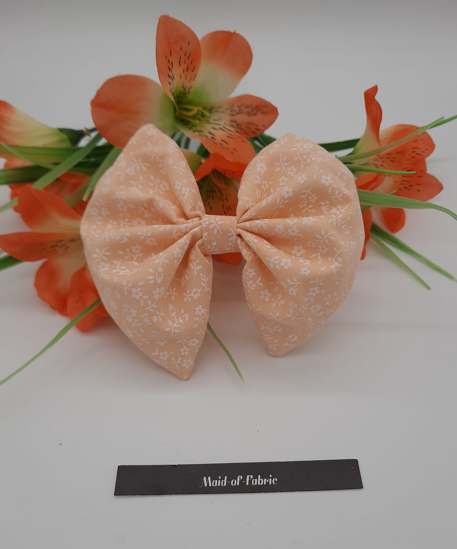 Clip on hair bow, peach floral,  3 for 2 offer. 