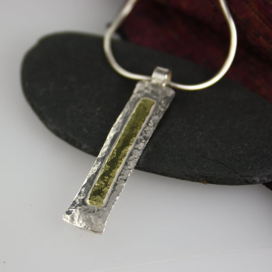 Silver and 18 ct gold pendant and chain