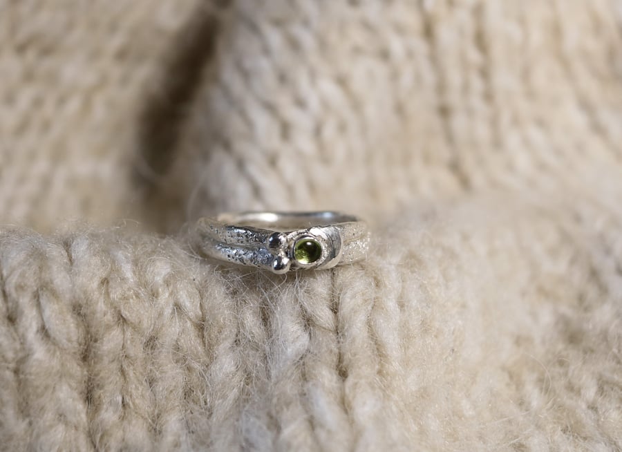 Silver ring with a crescent moon and 3mm peridot gemstone in size L