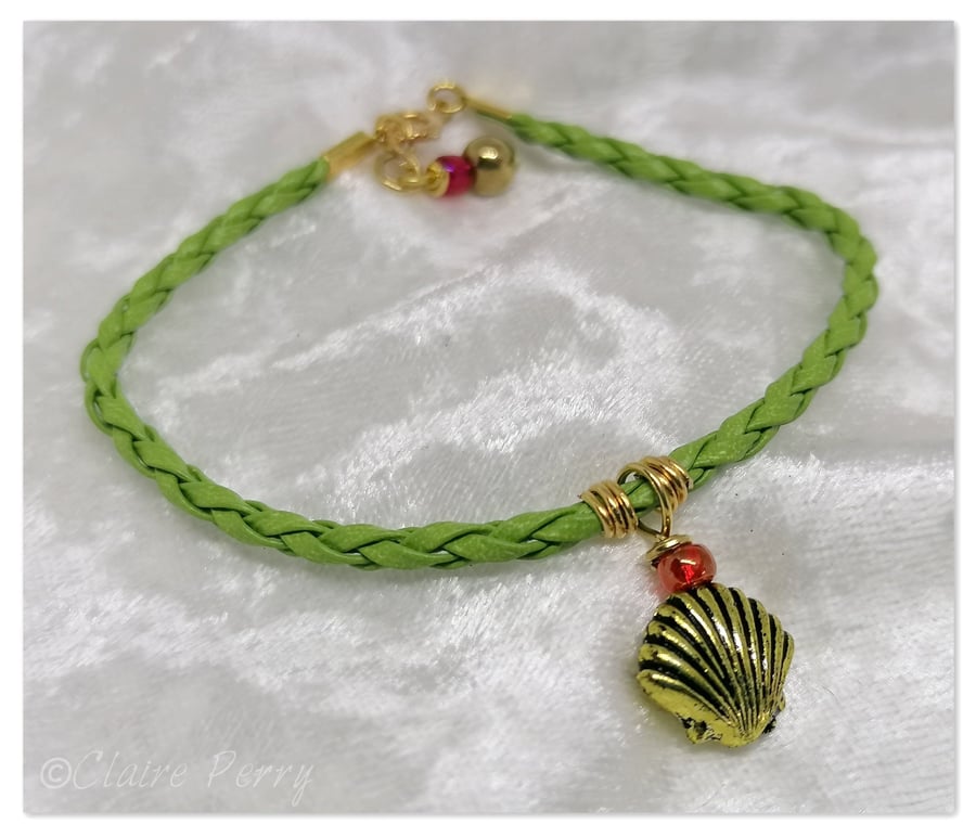 Bracelet Light Green Faux Leather with gold plated charm bead.