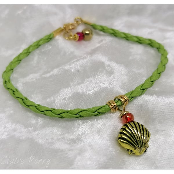 Bracelet Light Green Faux Leather with gold plated charm bead.