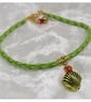 Bracelet Light Green Faux Leather with gold plated charm bead. - Image 1