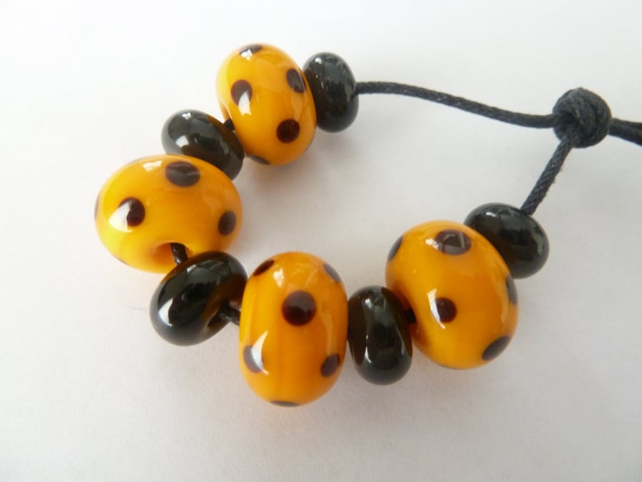 yellow and black dots lampwork beads