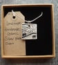 Handmade Ceramic Landscape pendant in black, white and grey - Image 5