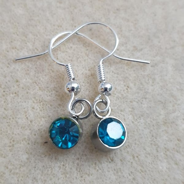 sweet little silver plated earrings with mini turquoise blue glass pendants
