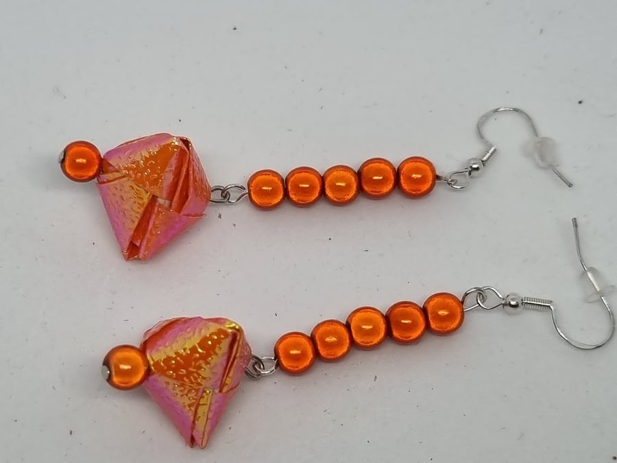 Origami earrings:  orange iridescent paper and miracle beads 