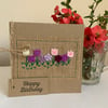 Birthday card. Row of purple and pink spring flowers. Wool felt. Handmade Card.