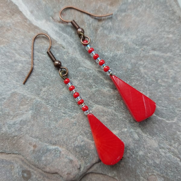Dangle earrings with red coral