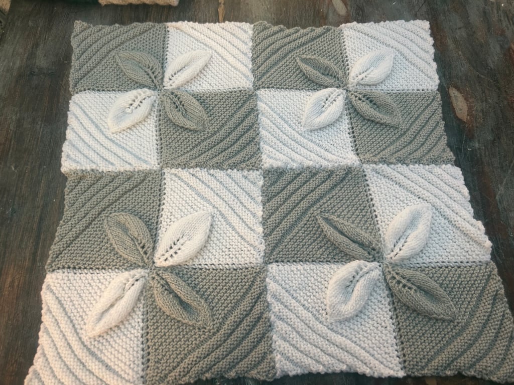 Hand knitted leaf blankets for babies , baby shower gift .