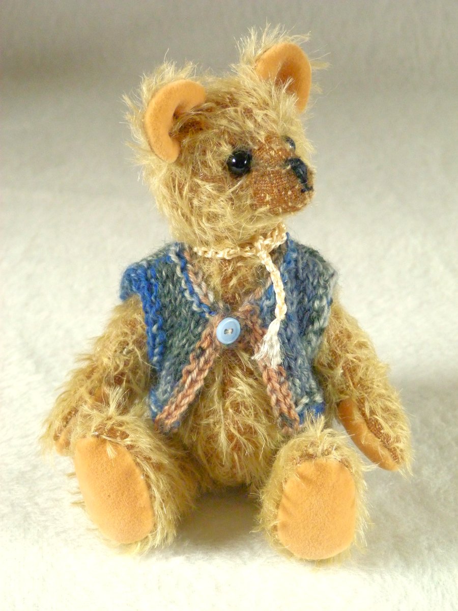 Woody, a 6" collectable mohair bear with a knitted waistcoat