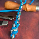 Round braid into modified diamond into diamond knot Paracord lanyard.