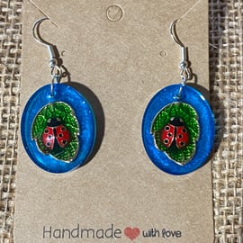 Handmade Small Oval Resin Earrings Featuring Ladybird On Leaf