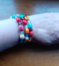 MULTI COLOURED HANDMADE CERAMIC MEMORY WIRE BRACELET. - Image 3